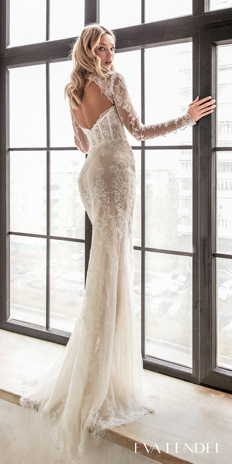 https://www.weddinginspirasi.com/wp-content/uploads/2020/07/eva-lendel-2021-bridal-long-sleeves-illusion-high-neck-diamond-neckline-heaviy-embellished-bodice-elegant-romantic-fit-and-flare-wedding-dress-keyhole-back-sweep-train-celine-bv.jpg