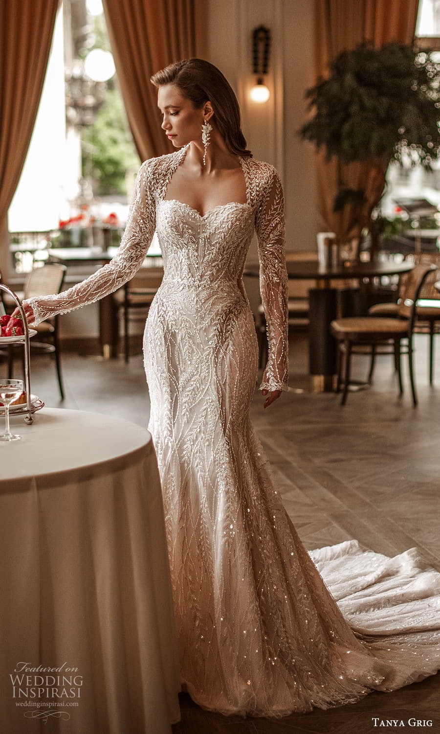 tanya grig 2025 bridal sheer long sleeve queen anne neckline fully embellished sheathe fit flare wedding dress chapel train (1) mv