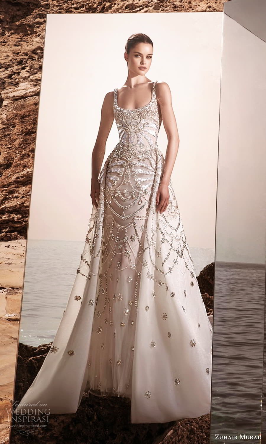 zuhair murad spring 2025 bridal sleeveless thick strap scoop neckline heavily embellished sheath wedding dress a line overskirt chapel train (4) mv