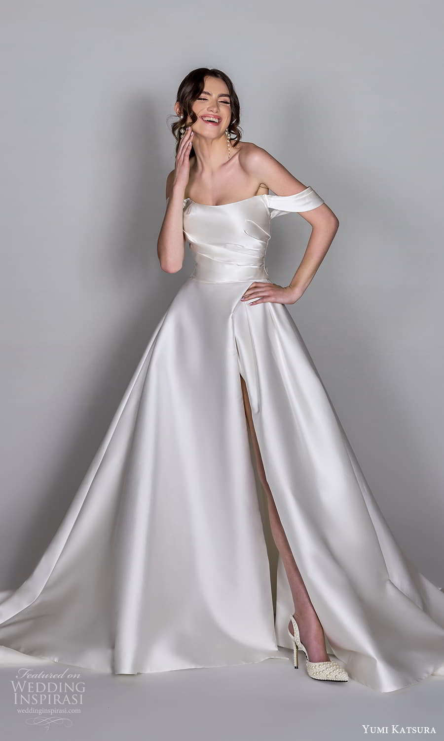 yumi katsura 2025 capsule bridal drape swag sleeve semi scoop neckline pleated bodice drop waist a line ball gown wedding dress chapel train (6) mv